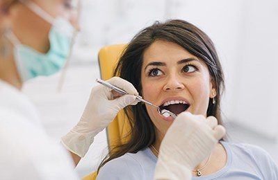 woman getting tooth removed